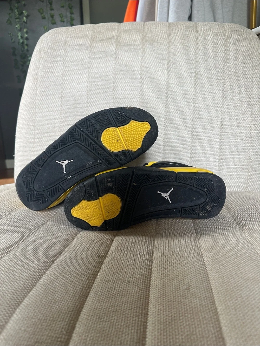 Black and Yellow Jordan 4s